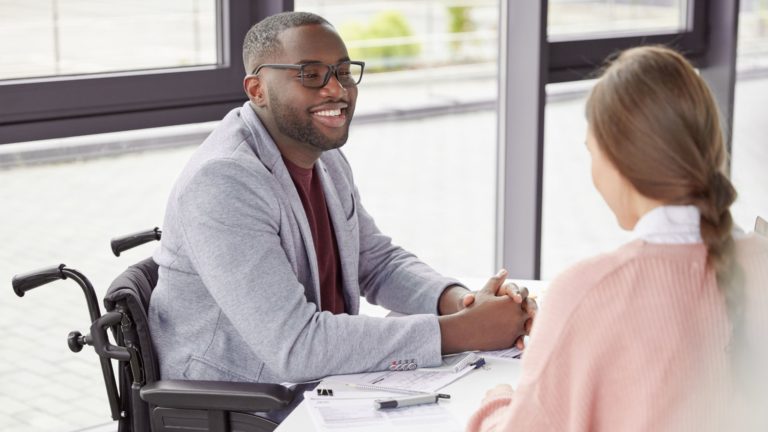 Manager discussing expectations with an employee | Limeade’s employee well-being program