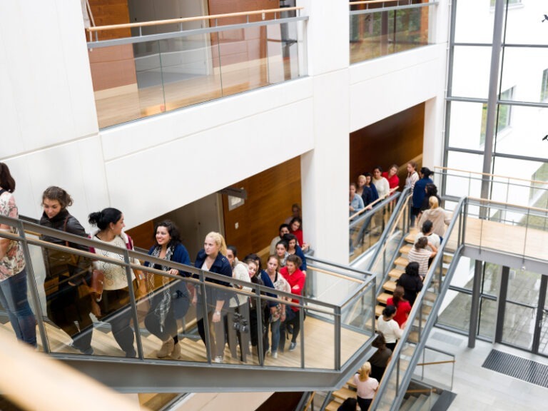 How You Can Get Up To A 90% Employee Survey Response Rate Limeade Listening crowd on stairs in public